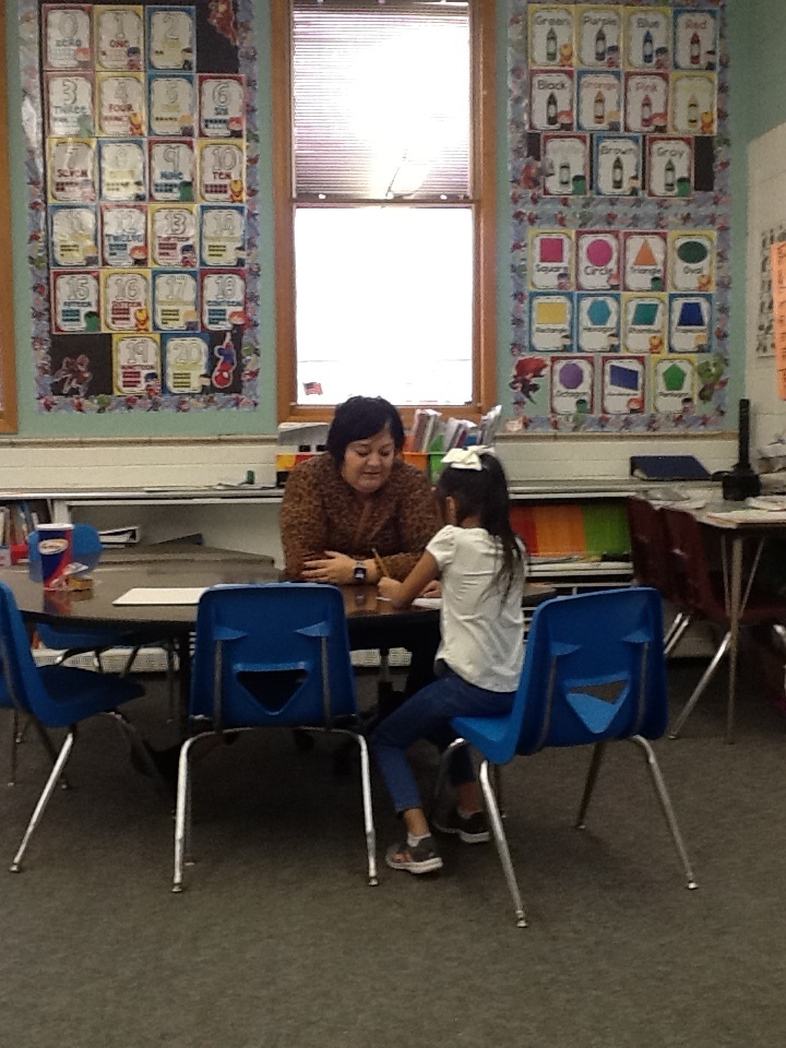 Our teachers take time to work with each student and care about everyones success. Just look at Mrs. Bencomo helping out one of her students. Thanks to Mrs. Miles class for the photo.