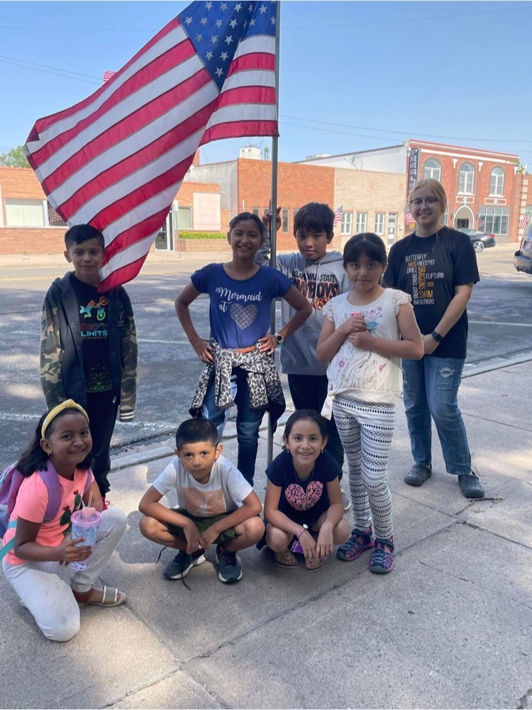 students by an American flag