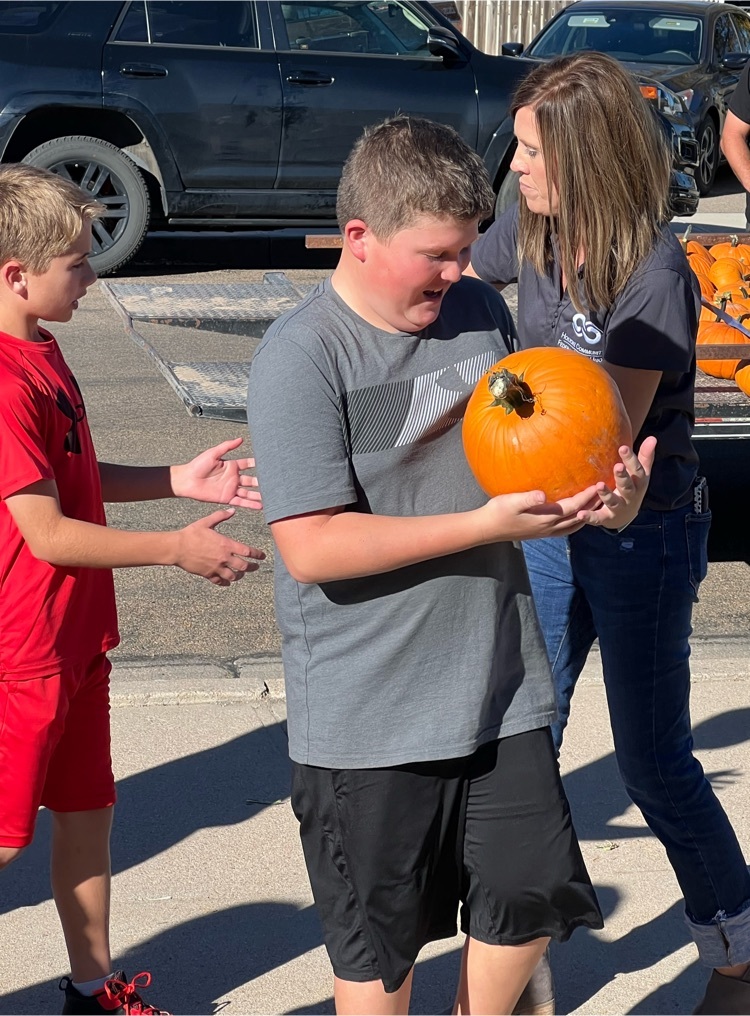 student with a pumpkin 